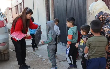 توزيع ألبسة شتوية على الأطفال في إقليم الجزيرة