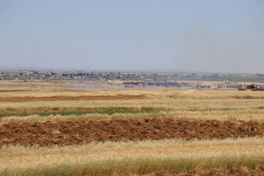 Turkish bombing causes a fire to break out in agricultural field