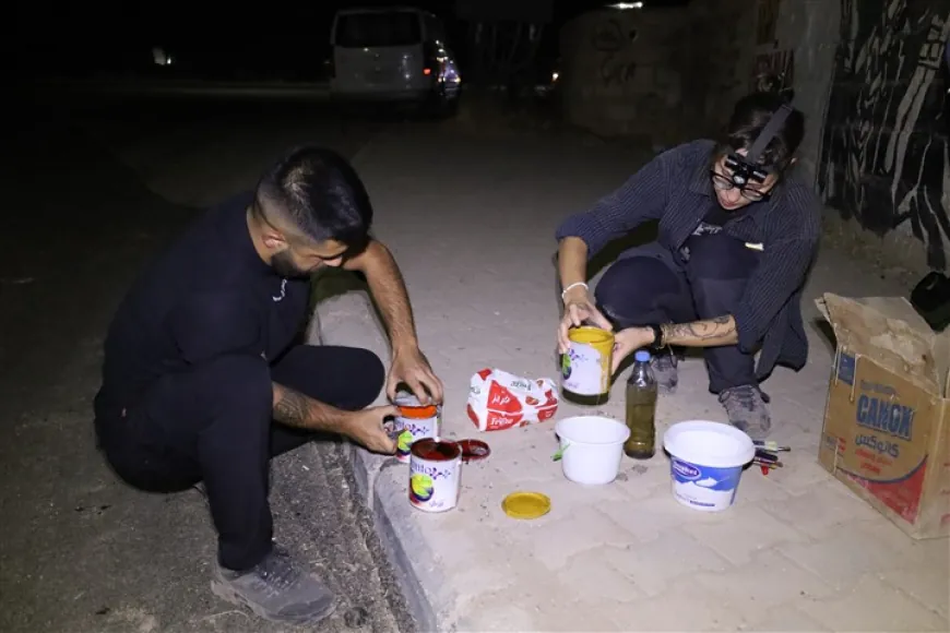 رسم على الجدران في مدينة تل تمر دعماً للغة الكردية