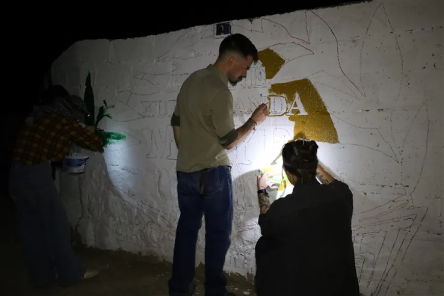 رسم على الجدران في مدينة تل تمر دعماً للغة الكردية