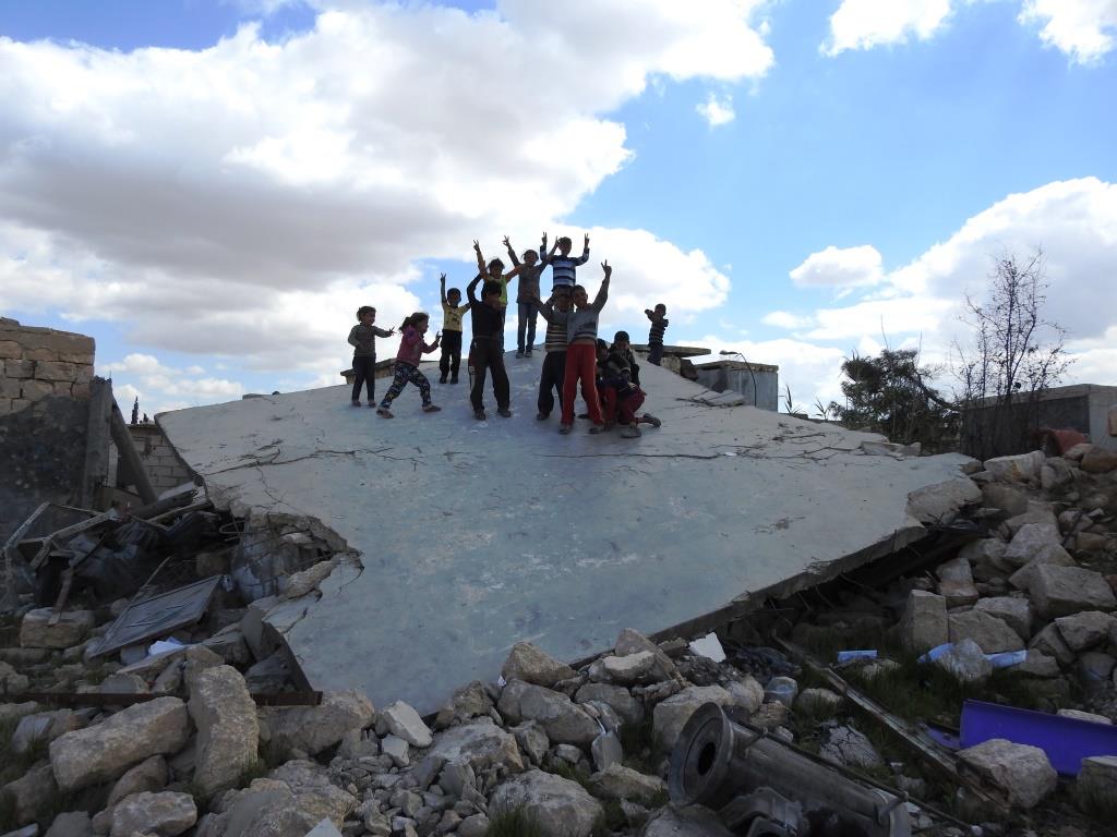 Afrin people raise resistance banners amid destruction