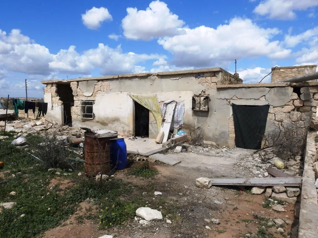 Afrin people raise resistance banners amid destruction