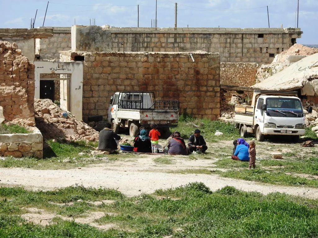 Afrin people raise resistance banners amid destruction
