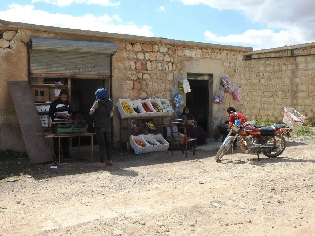 Afrin people raise resistance banners amid destruction
