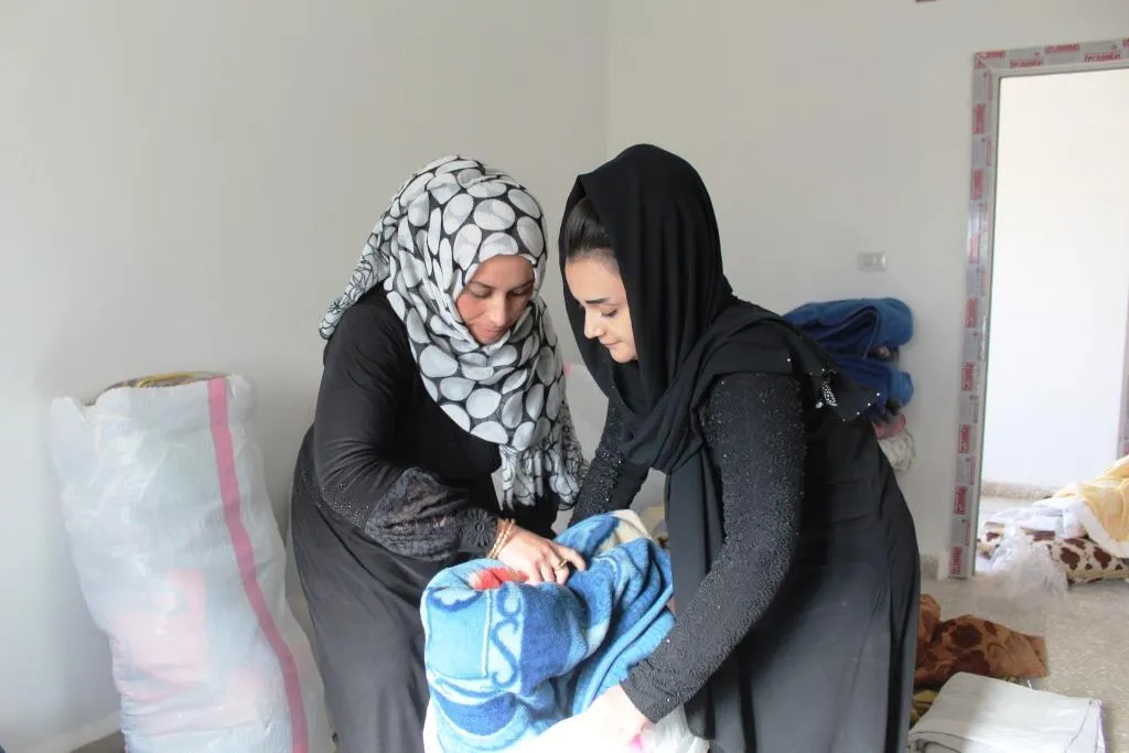 People of rural Northern al-Raqqa collect aids for Afrin