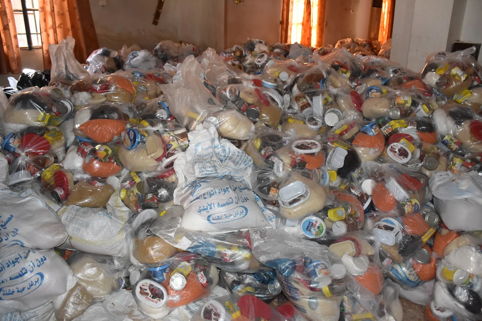 Aid sent by al-Jazeera, Euphrates regions distributed to Afrin people