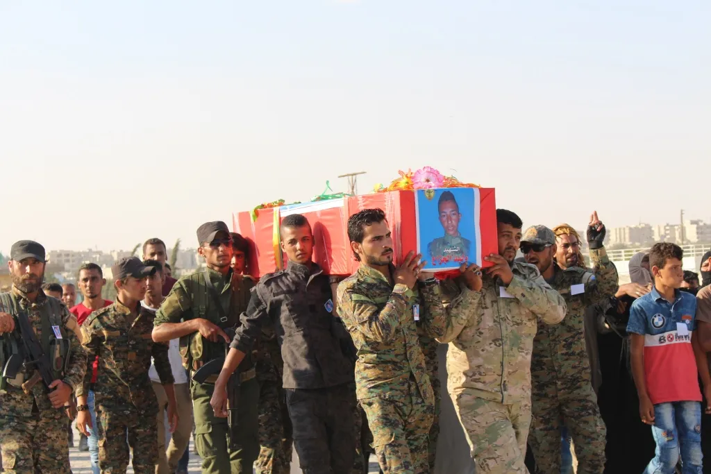 Manbij bid farewell martyr Walid al-Ali al-Jazaa 's corpse