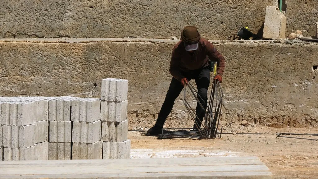Double efforts of Ain Issa people to rebuild their district