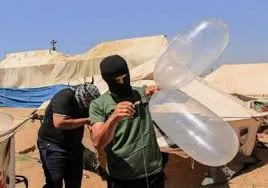 Israeli raids targeted youths launched burning balloons