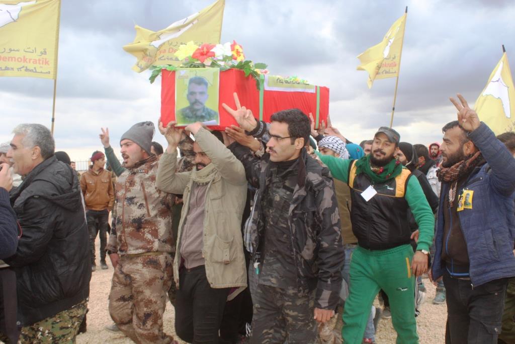 Al-Raqqa city bid farewell battle to defat terrorism martyrs' corpses