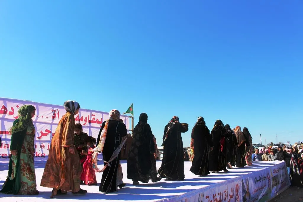 Al-Raqqa women concluded their celebration by saluting strugglers, presenting artistic performances