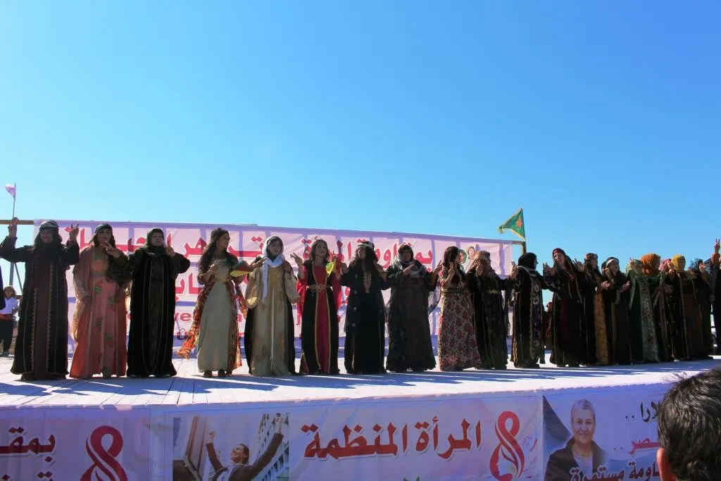 Al-Raqqa women concluded their celebration by saluting strugglers, presenting artistic performances