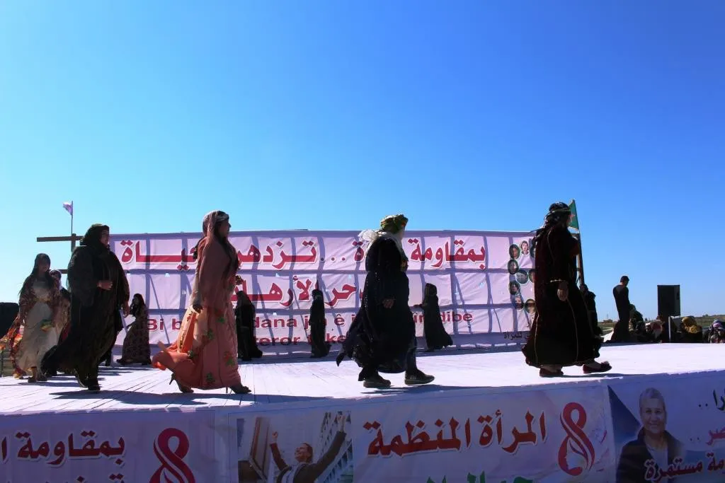 Al-Raqqa women concluded their celebration by saluting strugglers, presenting artistic performances