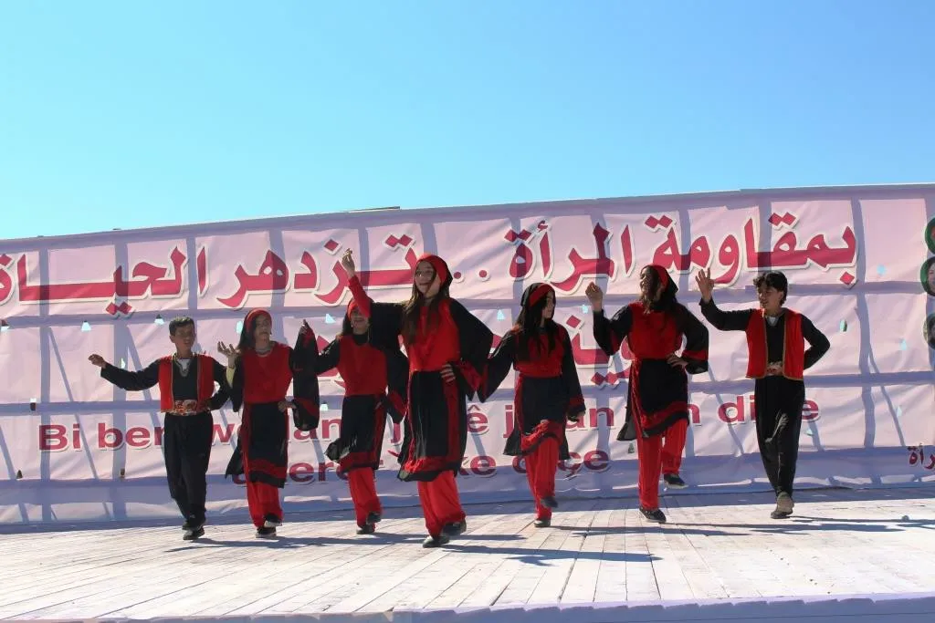 Al-Raqqa women concluded their celebration by saluting strugglers, presenting artistic performances
