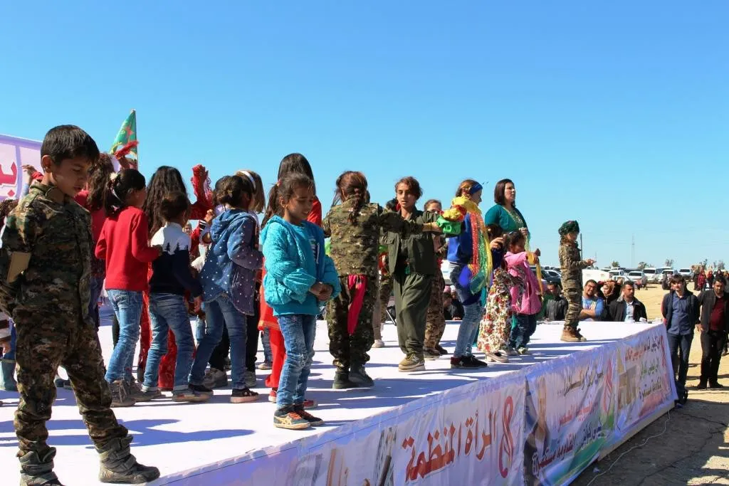 Al-Raqqa women concluded their celebration by saluting strugglers, presenting artistic performances