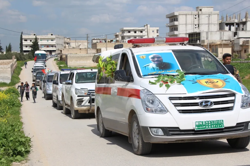Manbij bid farewell 2 martyrs' corpses