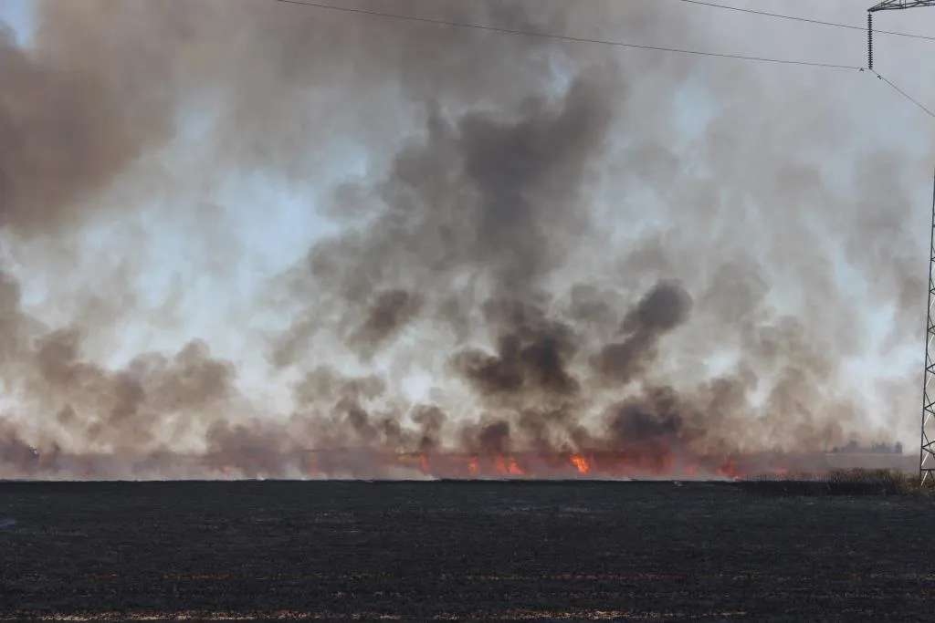 Firefighting teams extinguish a huge fire east of Tel Hamis