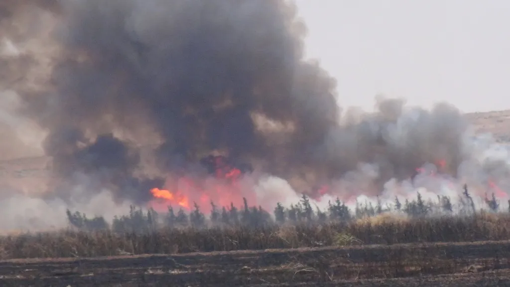 A fire consumes large tracts of land in Shiran district