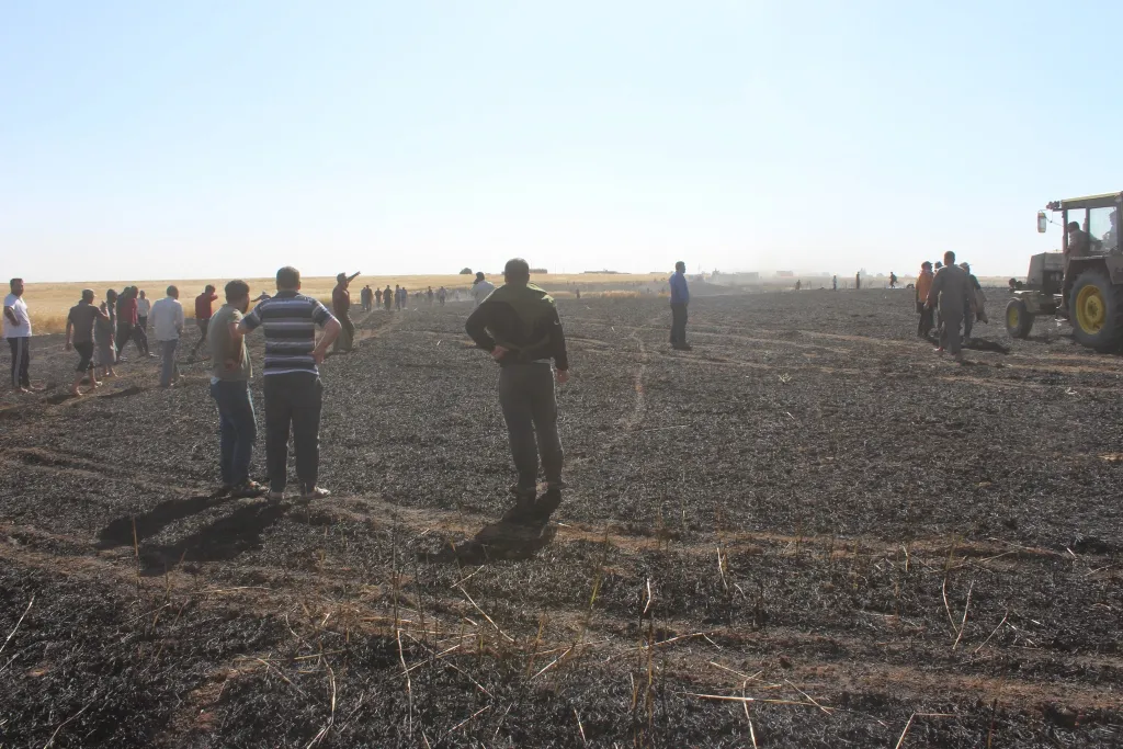 Fire extinguished after consuming 26 villages' fields in Tal Hamis, ad-Darbasiya