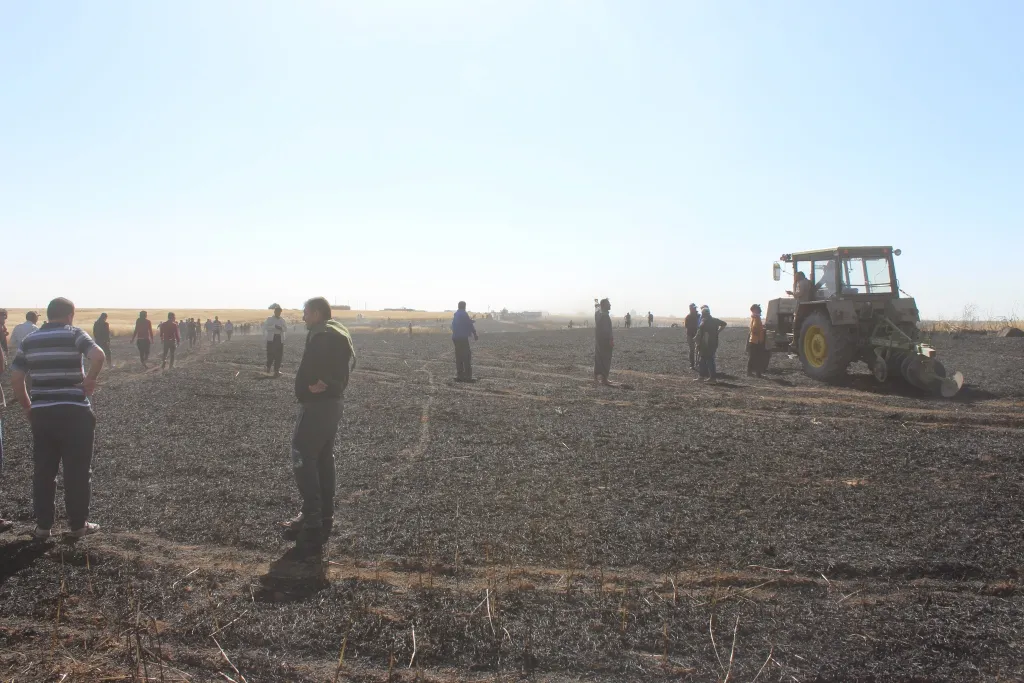 Fire extinguished after consuming 26 villages' fields in Tal Hamis, ad-Darbasiya