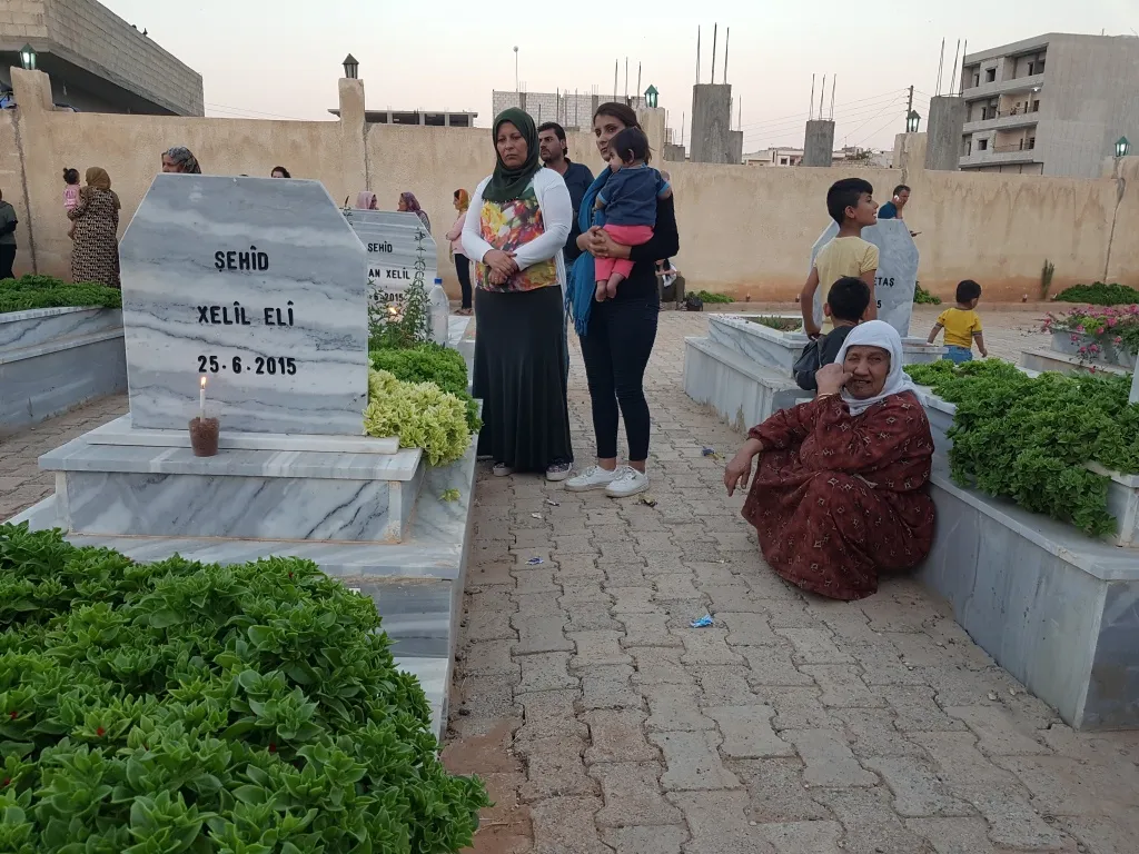 Kobani people light candles on 25th June martyrs' shrines