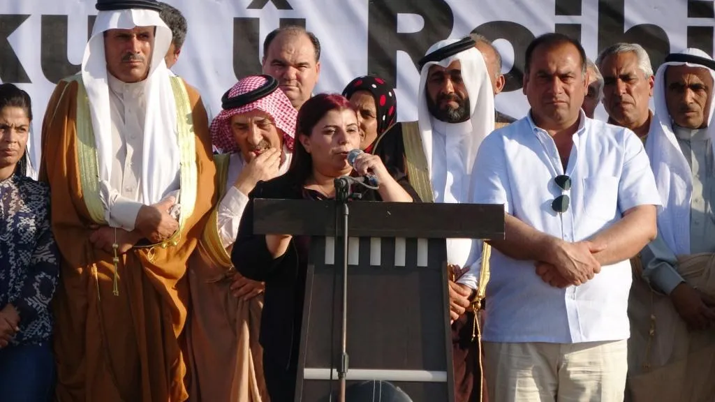 Thousands demonstrated in front of a coalition base to reject Turkish threats