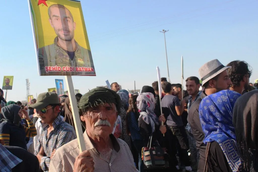 Thousands demonstrated in front of a coalition base to reject Turkish threats