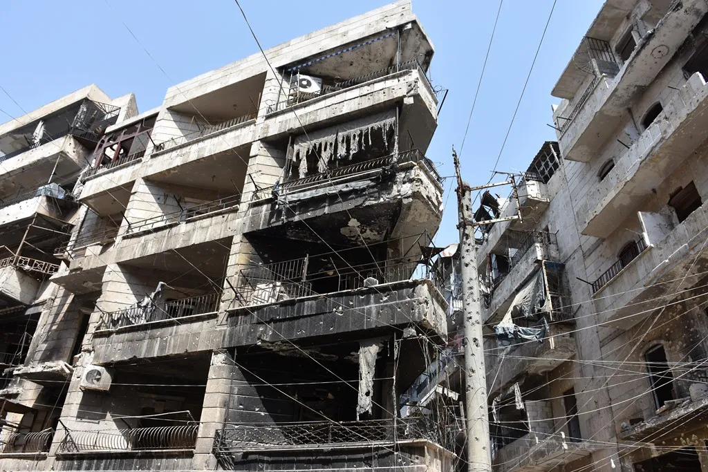 What did gangs do in corpses of its elements in al-Ashrafieh neighborhood?