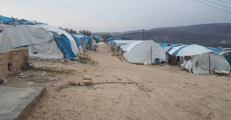  Killing, wounding 12 people in missile bombing on Qah camps in Idlib countryside