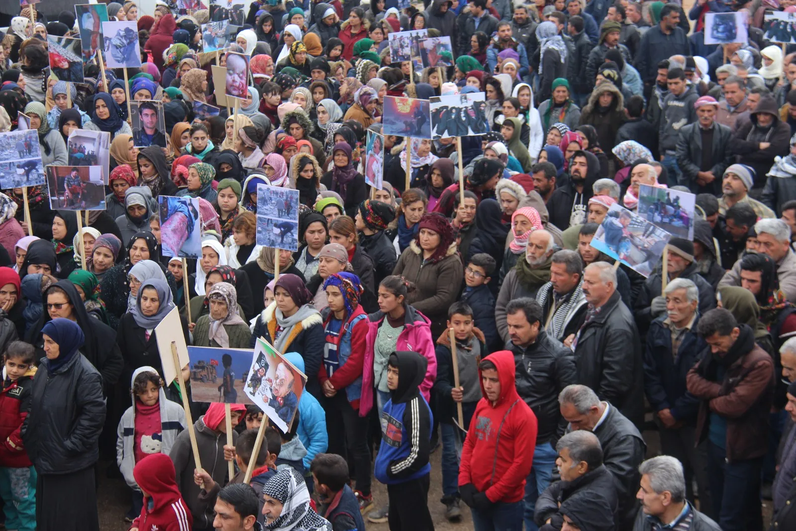 Thousands of displaced people mourn a civilian martyred while praying dawn in Turkish shelling