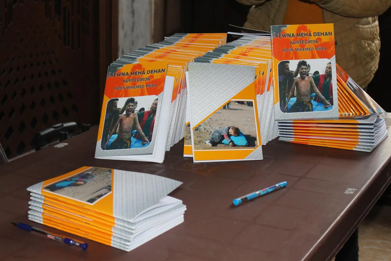 Signing "Dream of the Tenth Month" book by writer Rojin Musa