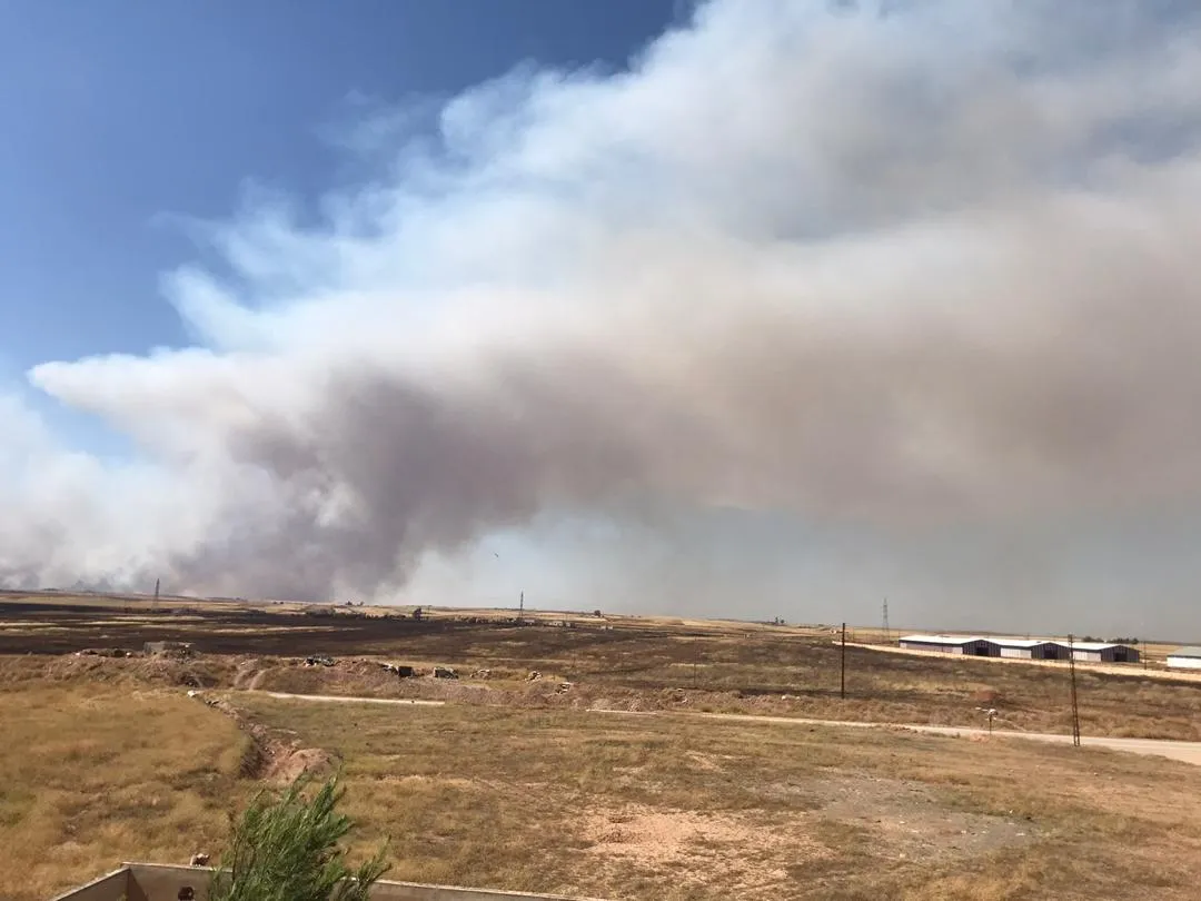 Turkey burns people's crops in rural Tel Tamr