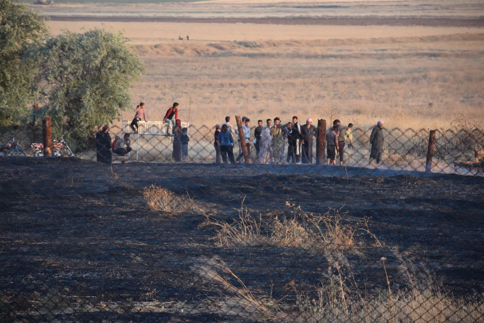 Turkish occupation's fire burns houses and suffocates civilians