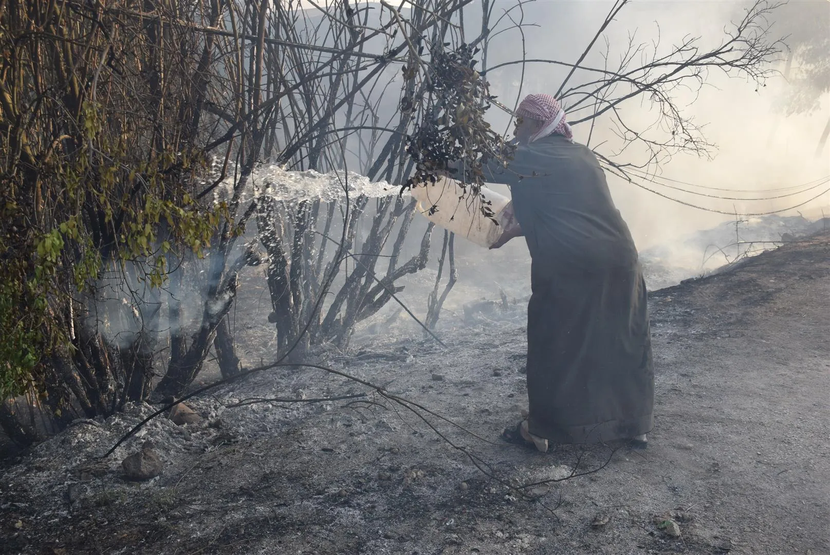 Turkish occupation's fire burns houses and suffocates civilians