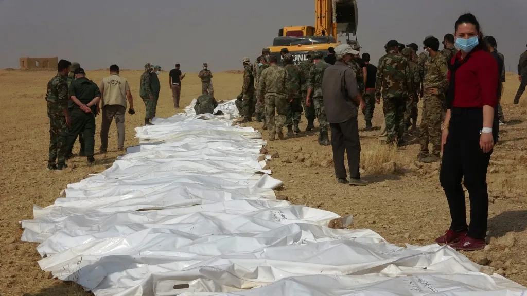 57 remains of "93rd Brigade" members exhumed from two cemeteries in Ain Issa countryside