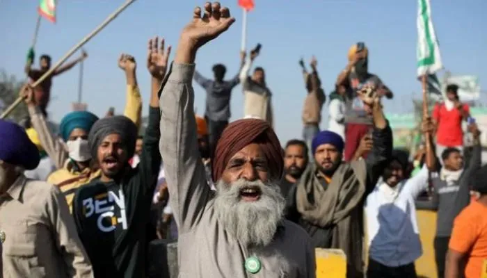 To prevent farmers from entering the capital, Indian police dig trenches and spread barbed wire