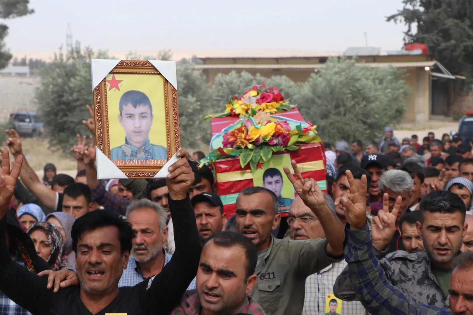 In solemn funeral ceremony, Afrin bid farewell to martyr Mazloum