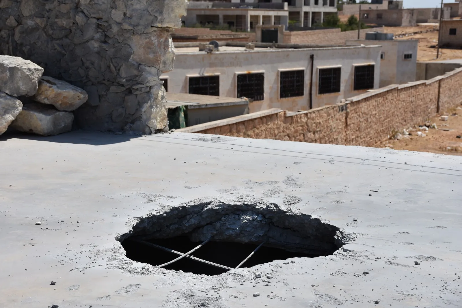 Turkish occupation targets Sherawa district inflicting damages to civilians’ homes