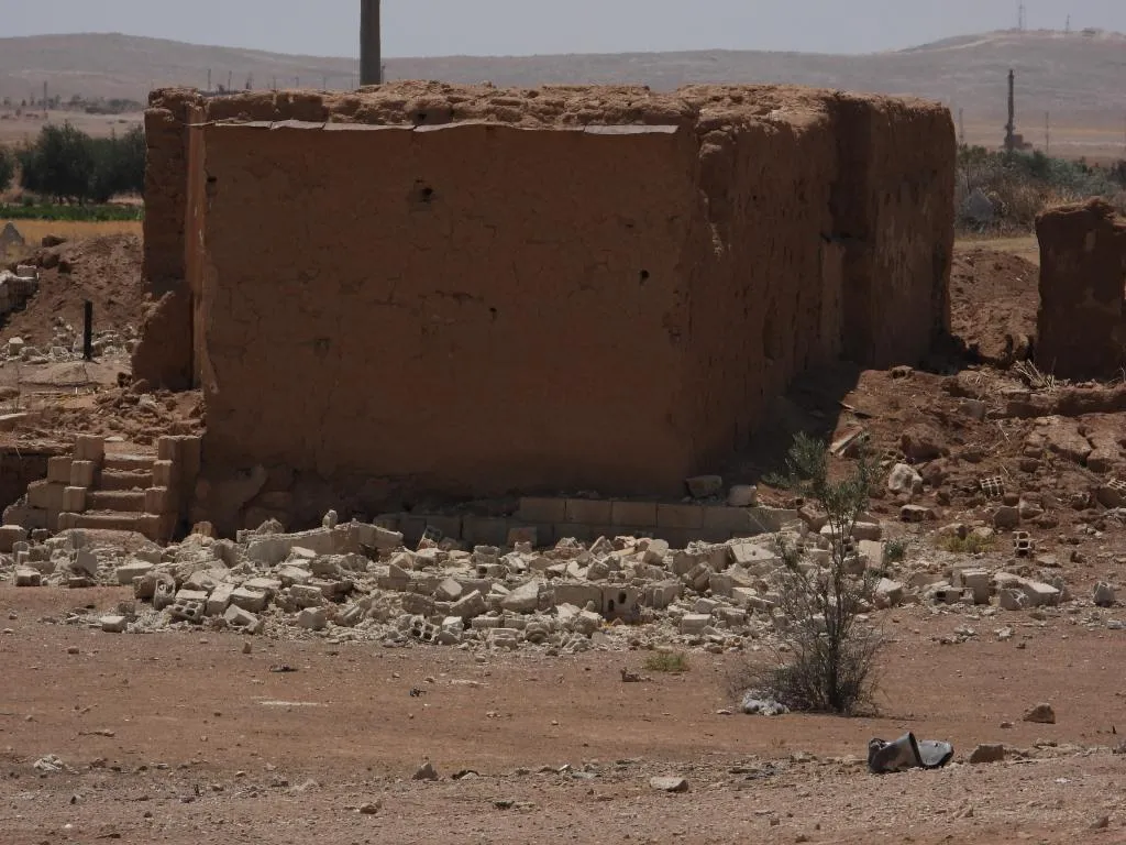 ANHA camera monitors damage left by Turkish occupation shelling on a village of Girê Spi