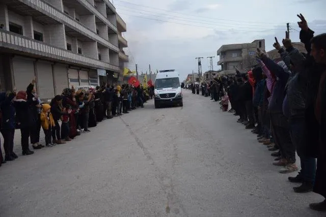 ​​​​​​​people of Kobani receive bodies of 12 martyrs of People's Hammer Campaign