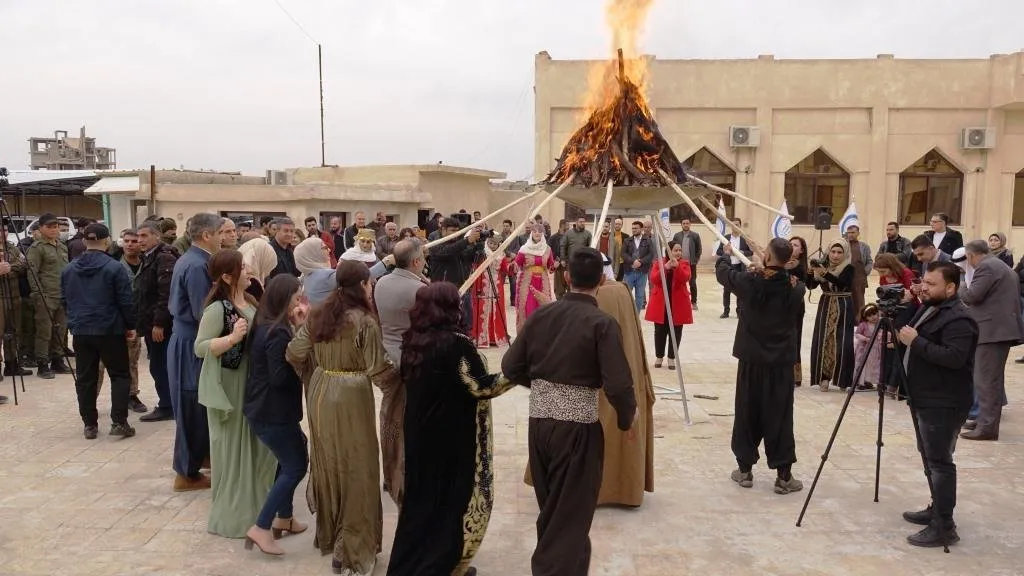 Autonomous Administration lights Newroz torch in square of its HQ in Raqqa