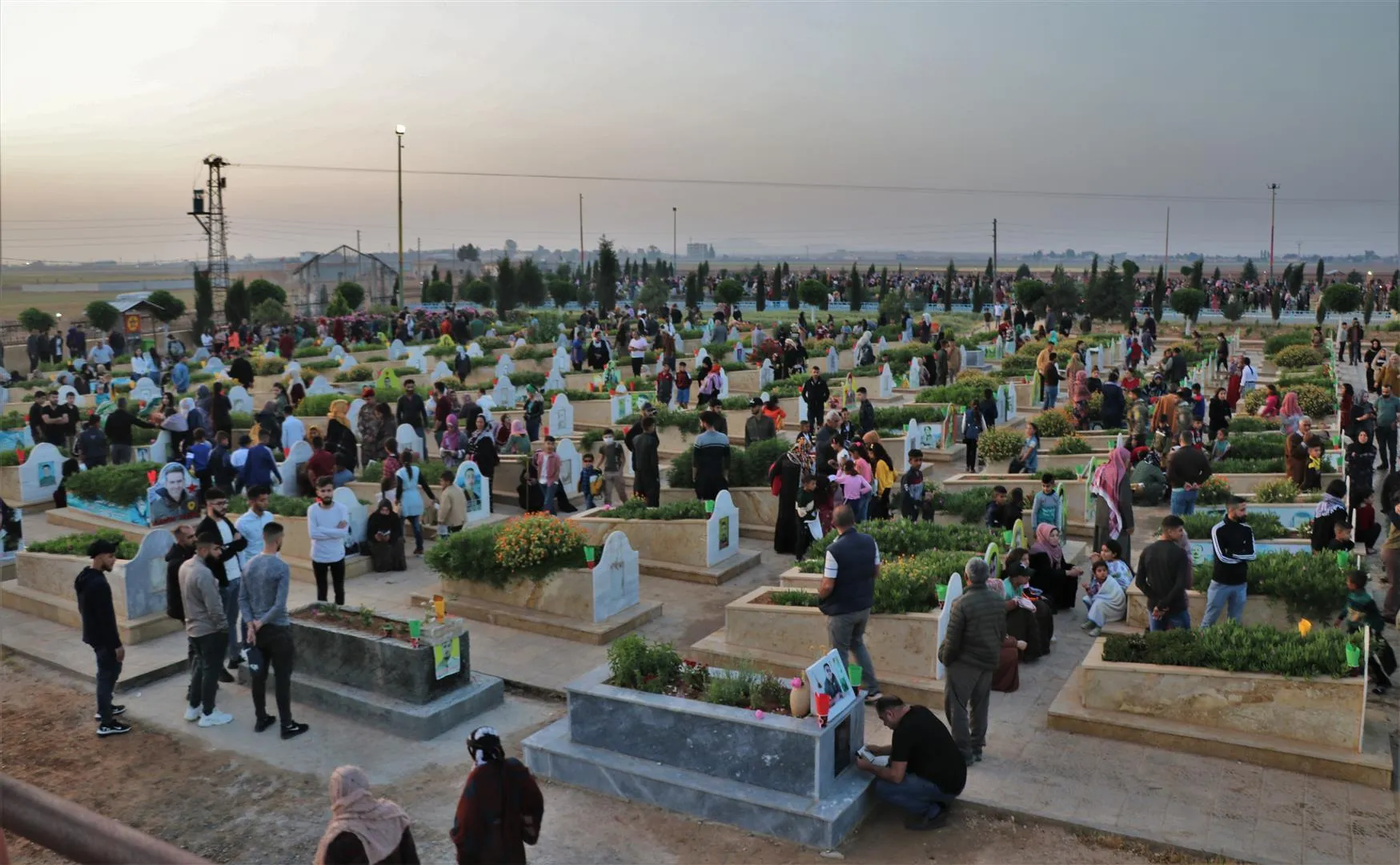 NE Syria people visit martyrs’ shrines in first day of Eid al-Fitr