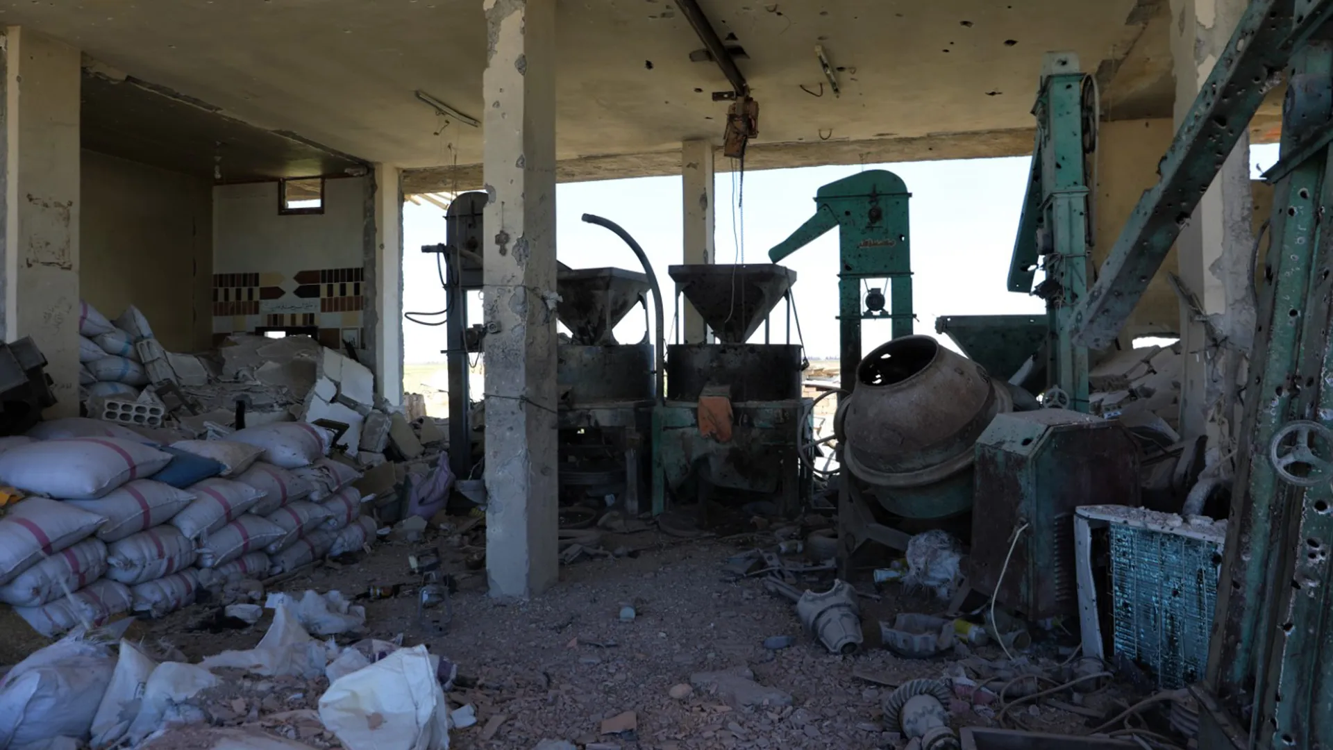Turkish occupation army destroys a mill and a grain selling center in Zerghan district.