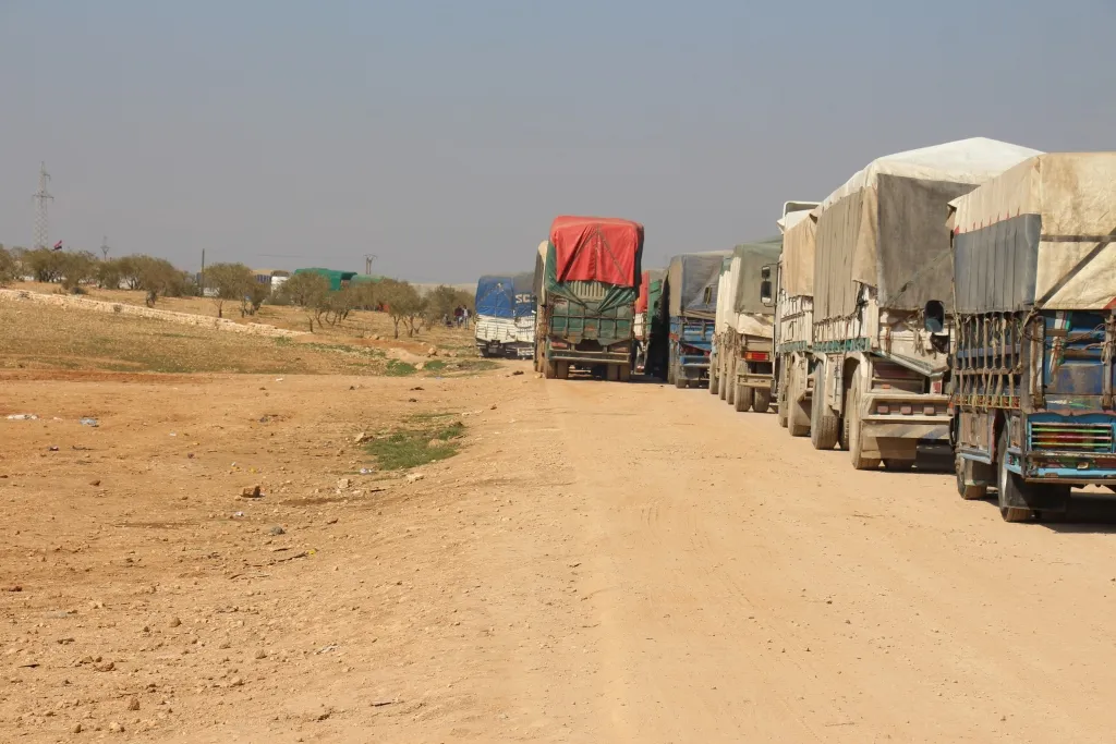 11 aid trucks cross from Al-Tayha crossing towards the areas affected by the earthquake