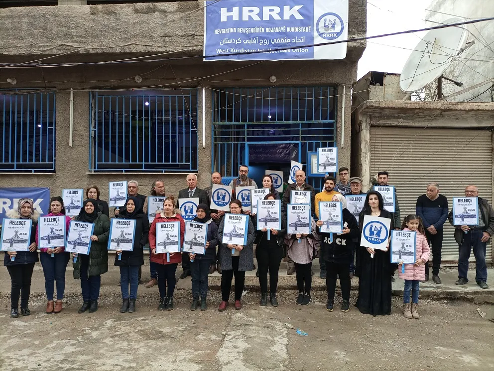 In honor of Halabça martyrs .. people of NE Syria stand 5 minutes of silence