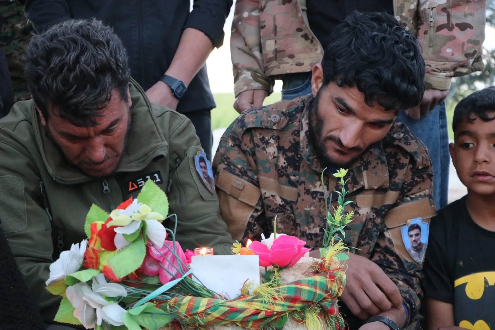 ​​​​​​​NE Syria people light candles on martyrs' graves on the occasion of Eid al-Fitr