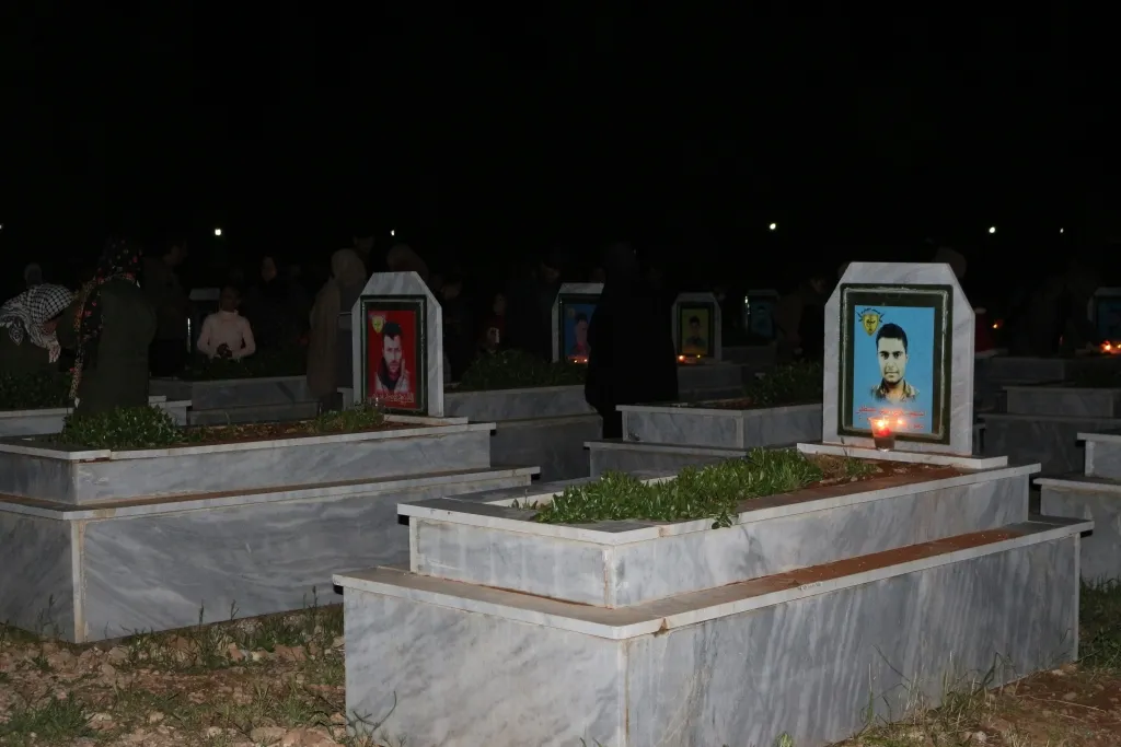 ​​​​​​​NE Syria people light candles on martyrs' graves on the occasion of Eid al-Fitr