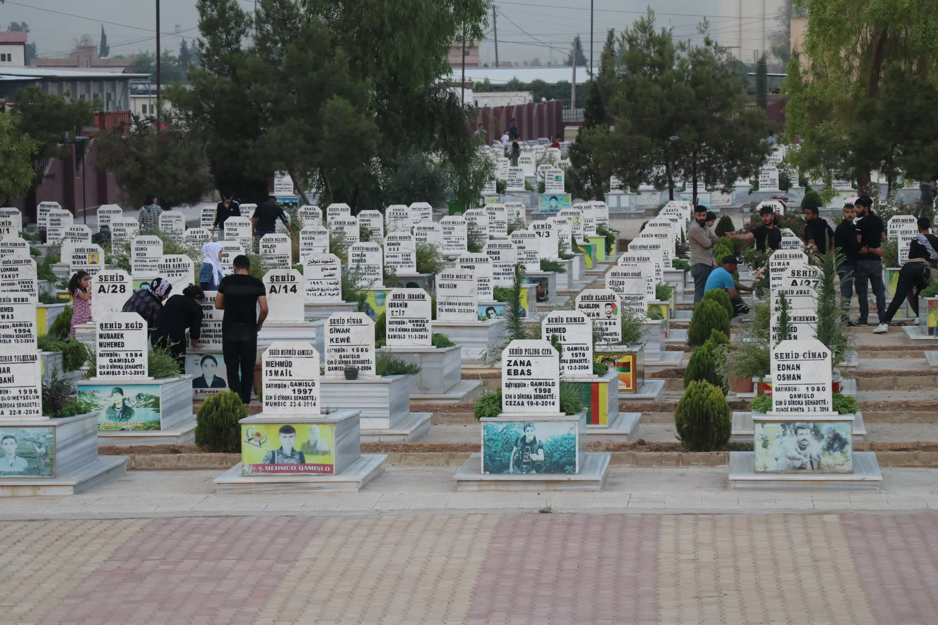 On the eve of Eid al-Adha, candles are lit at martyrs’ shrines