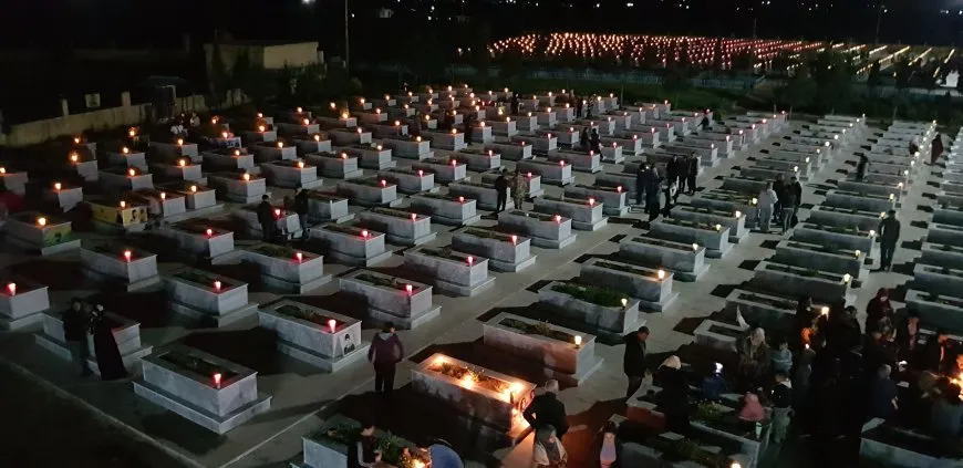 On the eve of Eid al-Fitr, candles are lit on martyrs' shrines 