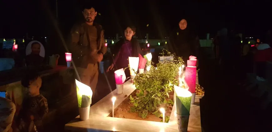 On the eve of Eid al-Fitr, candles are lit on martyrs' shrines 